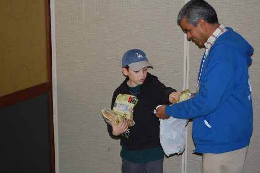 Destino Conference-Joshua Joshua fills the bag of one of our staff members